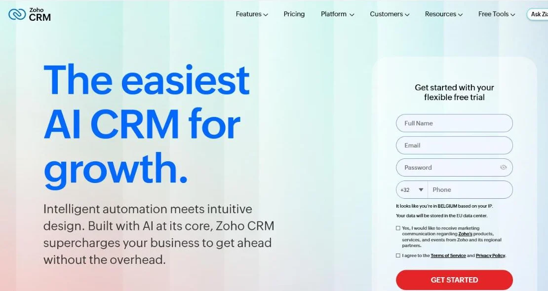 Zoho CRM homepage with a free sign-up button and an overview of the CRM